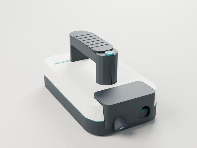 The Facade scanner concept: a white and charcoal handheld body with a palm grip and a sensor nose.