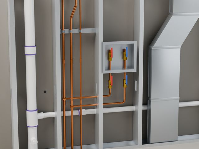 Close-up of copper supply lines and shutoff valves in the cavity.